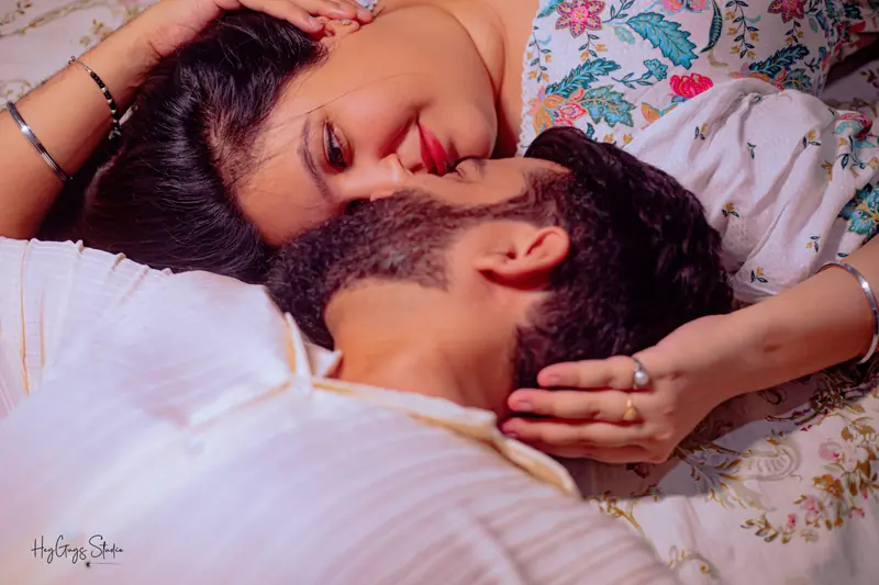 Intimate overhead portrait of a couple lying close together during a lifestyle shoot