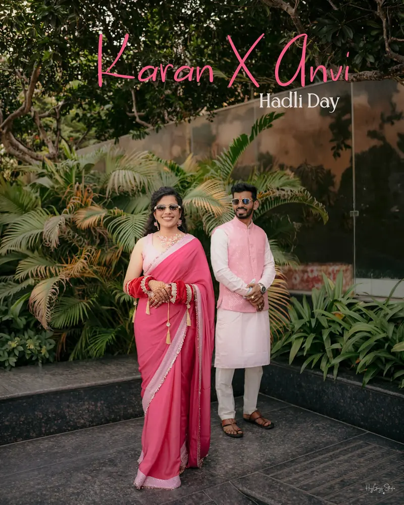Couple on their Haldi day, the bride in a pink saree, photographed in a garden setting